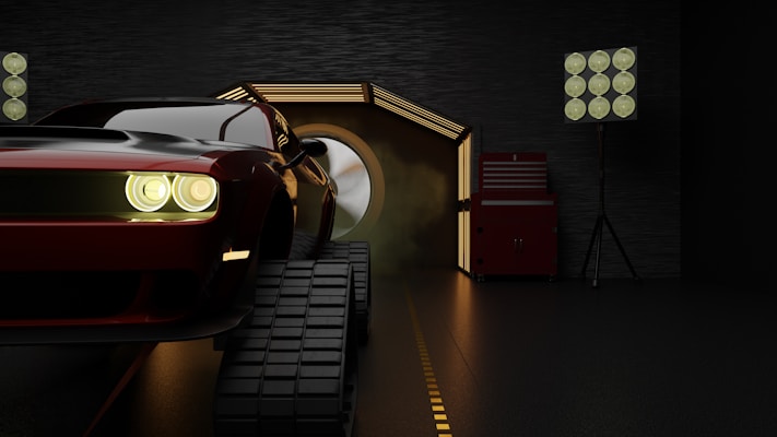 A dark environment with a red sports car featuring illuminated headlights, mounted on tracks as it emerges from a lit tunnel. The scene is framed by a modern industrial setting, including a red tool chest and studio lights.