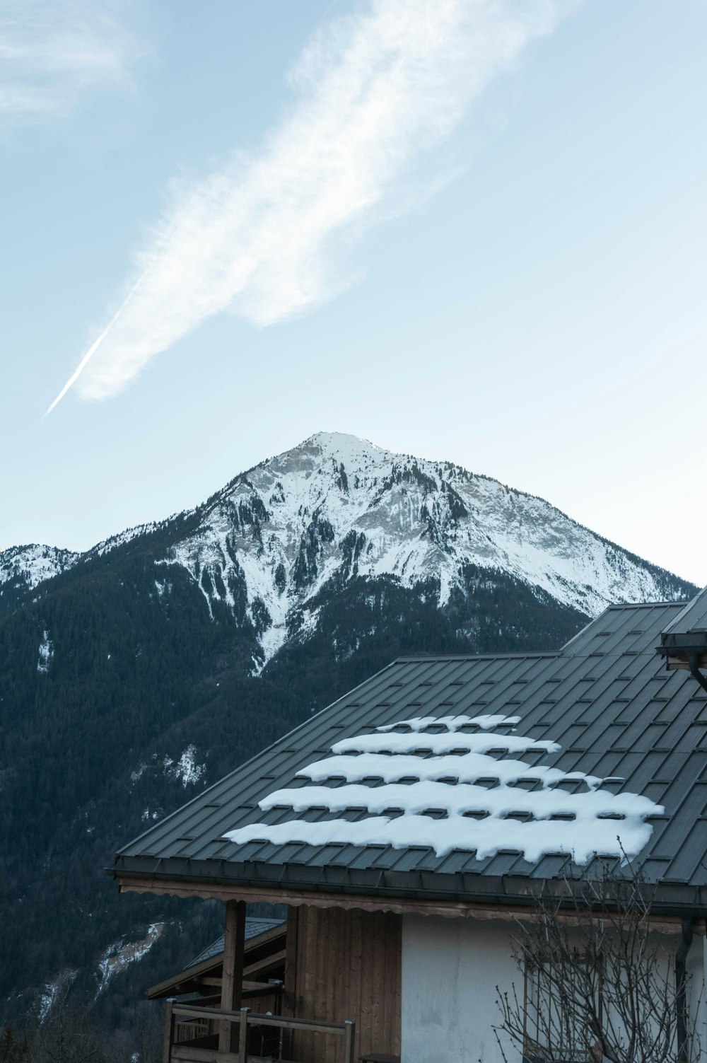 a house with a mountain in the background