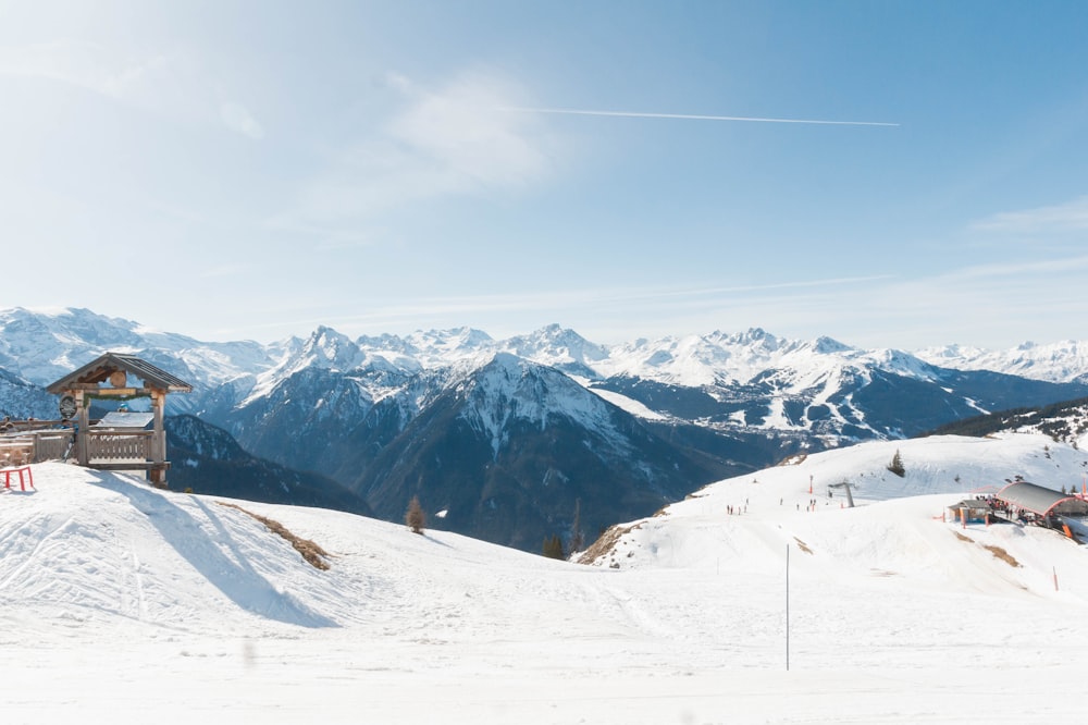 a man riding skis on top of a snow covered slope