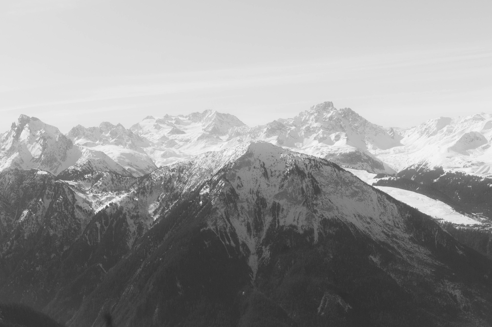a black and white photo of a mountain range