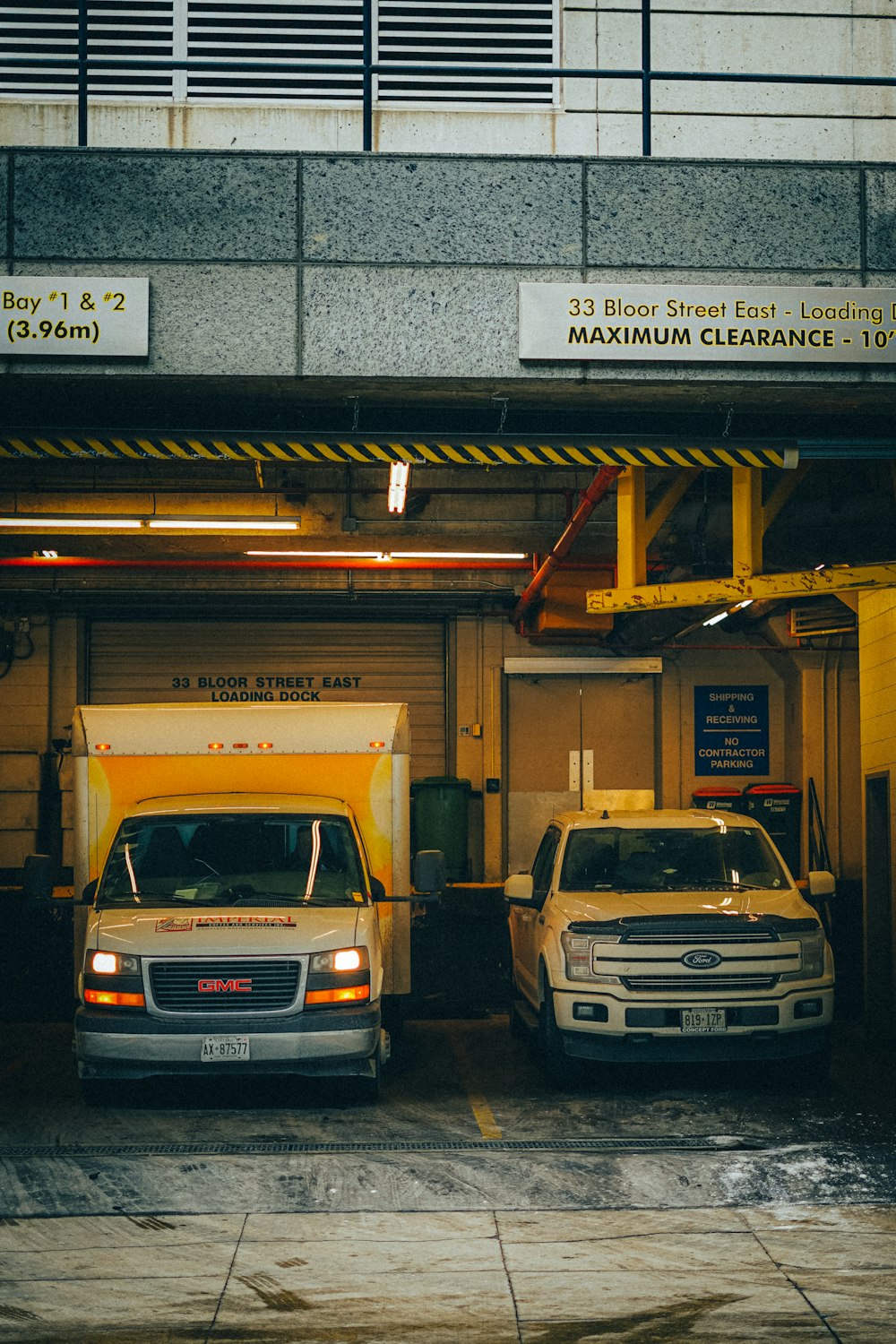 a couple of trucks parked in a garage