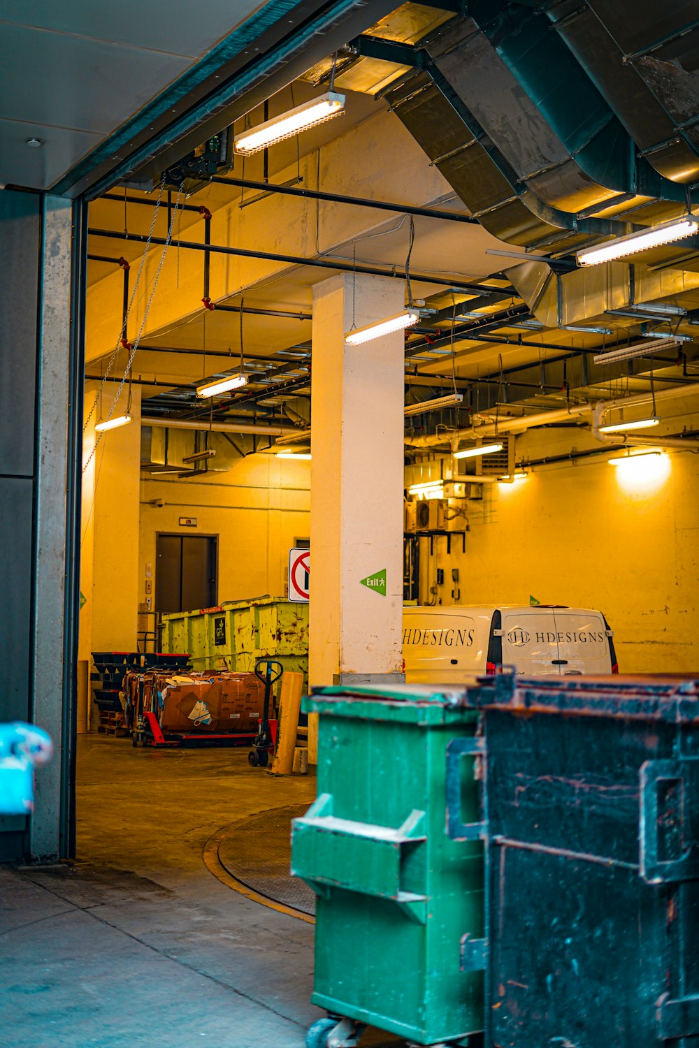 a large room with a bunch of trash cans in it