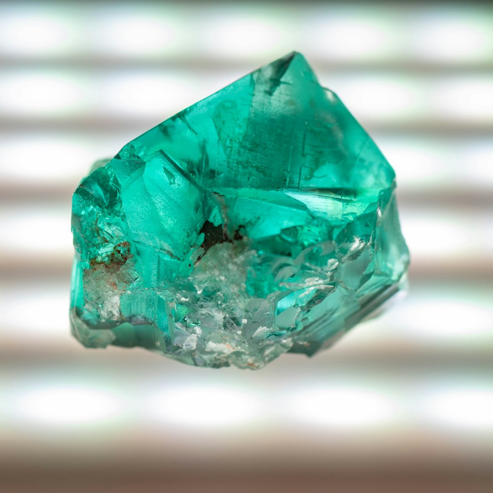 a large green diamond sitting on top of a table