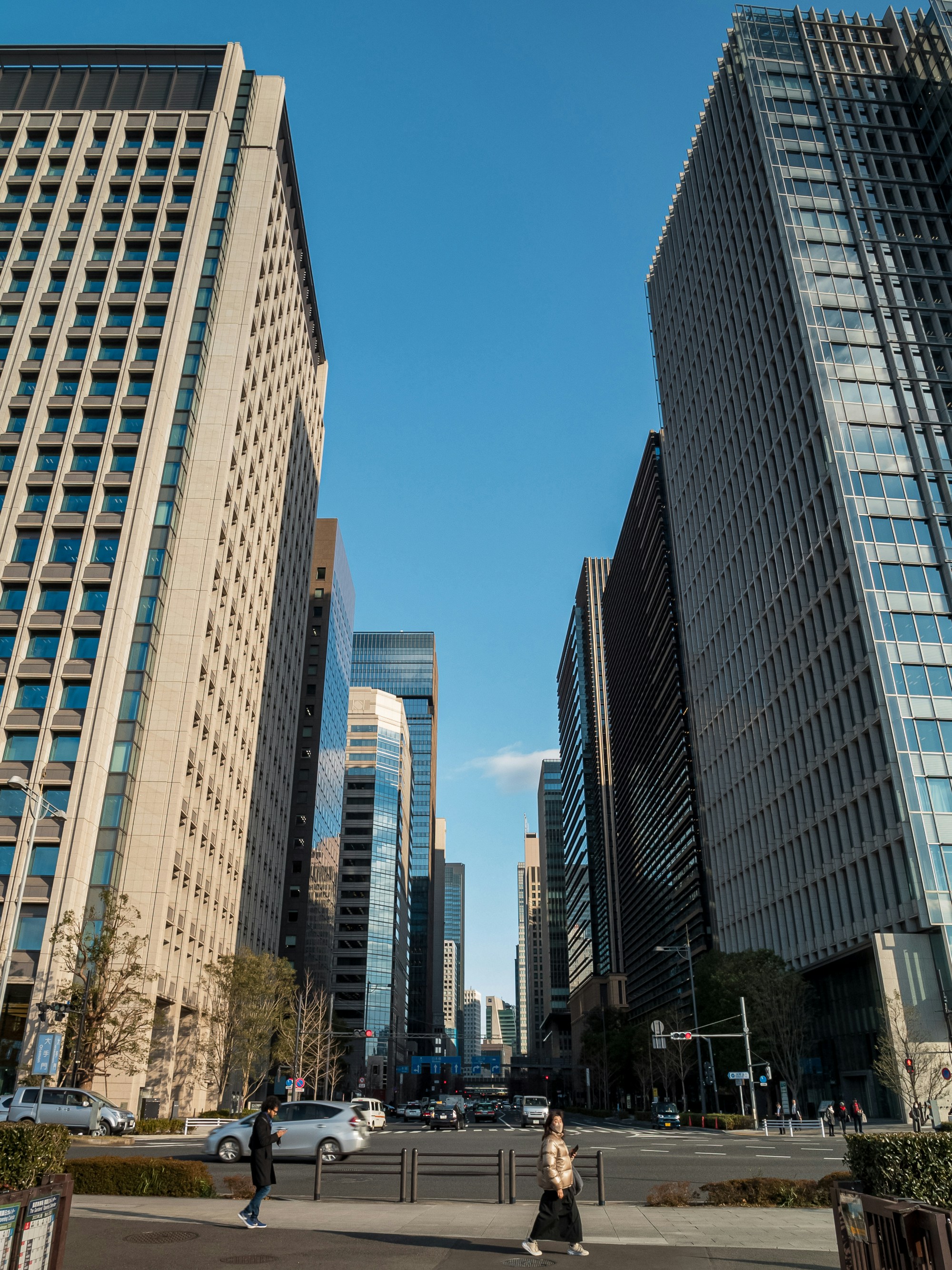 a couple of tall buildings sitting next to each other