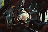 a close up of a steering wheel and dashboard of a car