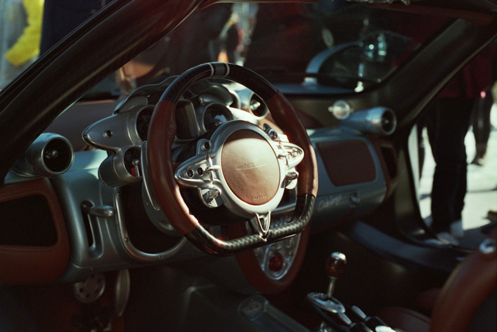 a close up of a steering wheel and dashboard of a car