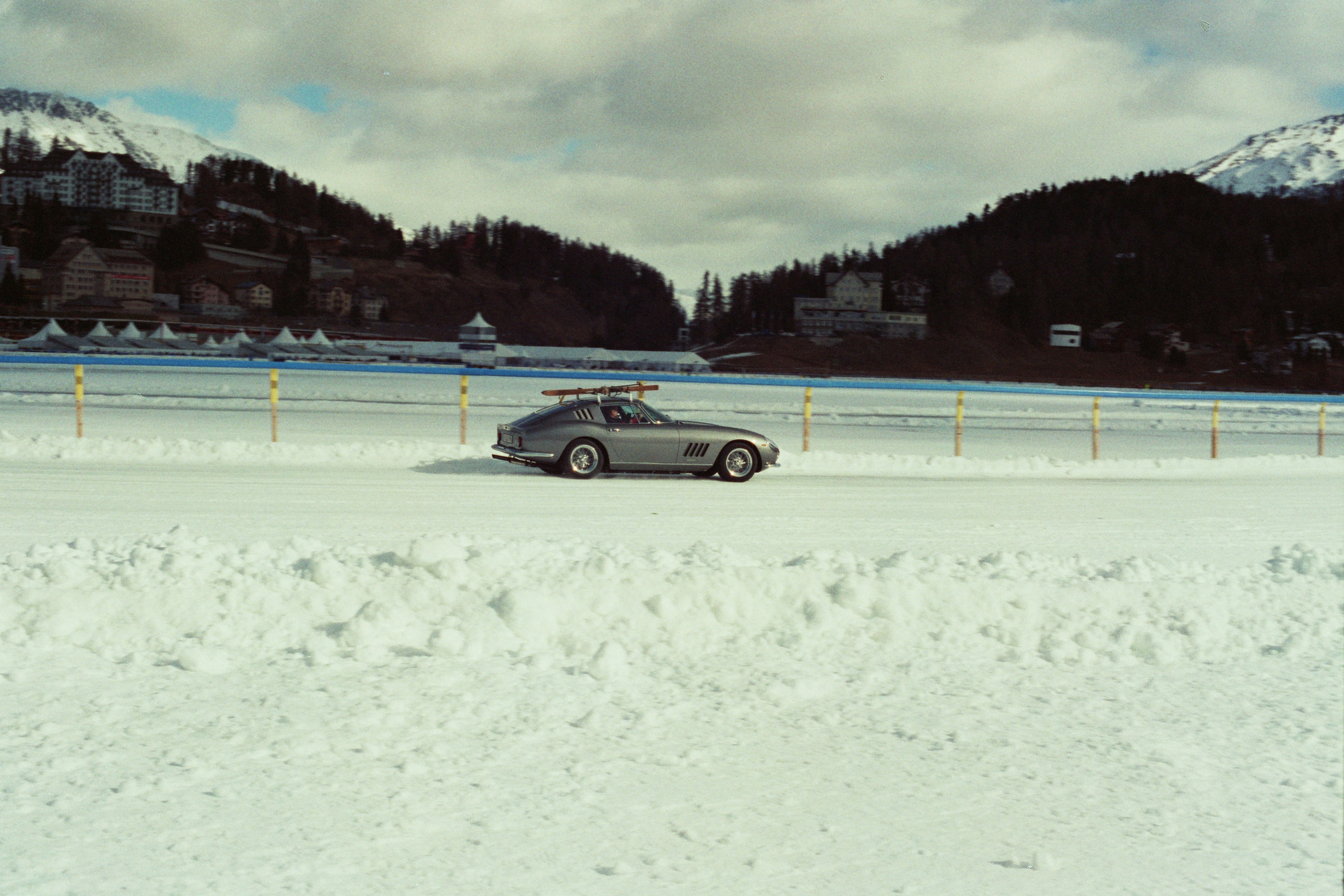 A car parked on a snowy road in front of a mountain photo – Free Sankt ...
