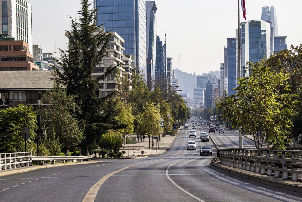 a city street with cars driving down it