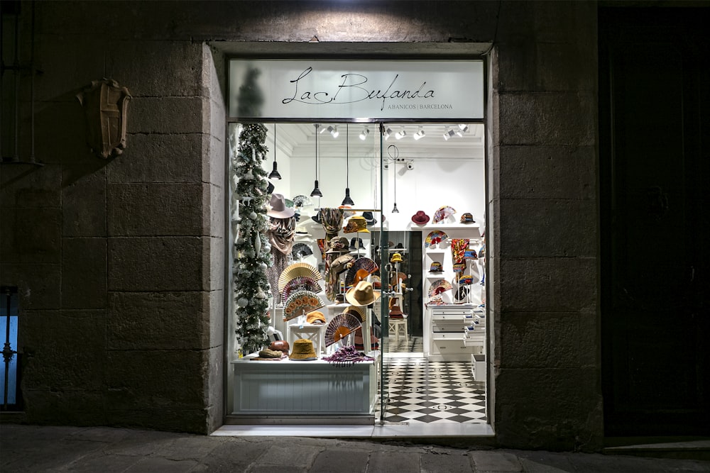 a store front with a lot of hats in it