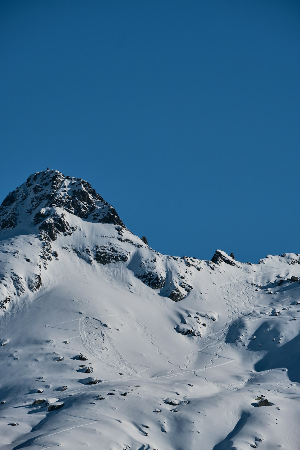 a person skiing down a snow covered mountain