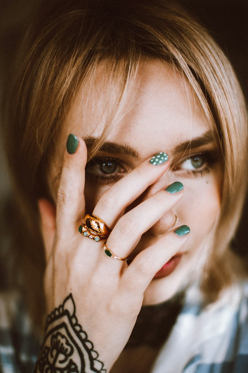a close up of a person with a ring on their hand