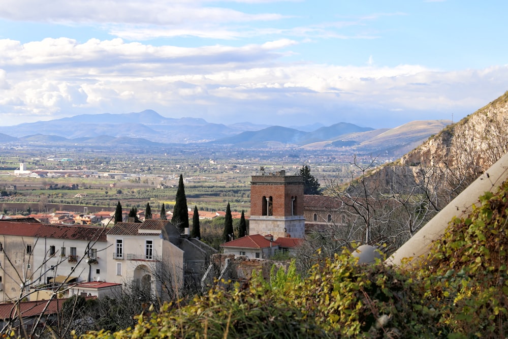 a view of a city with mountains in the background