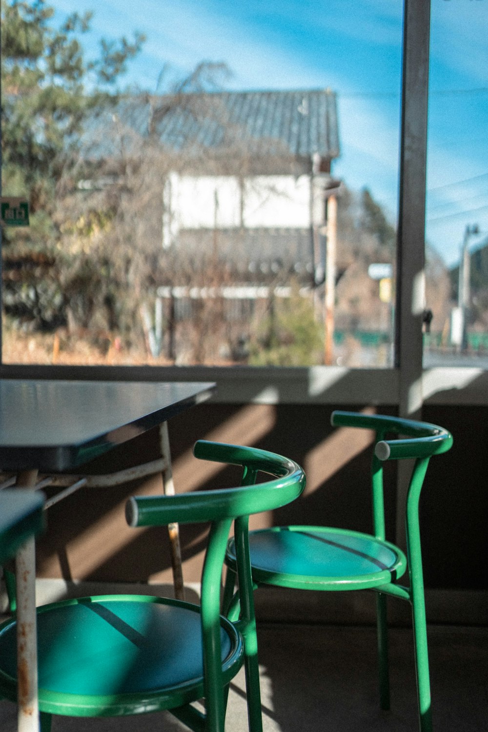 a couple of green chairs sitting next to each other