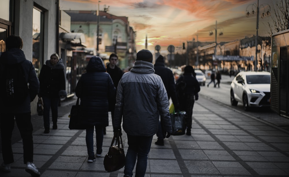 a group of people walking down a street