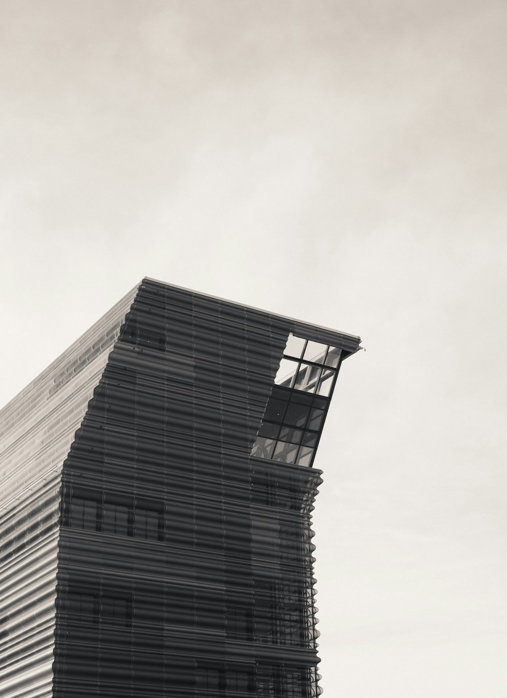 a black and white photo of a tall building