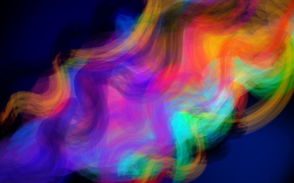 a blurry image of a rainbow colored background