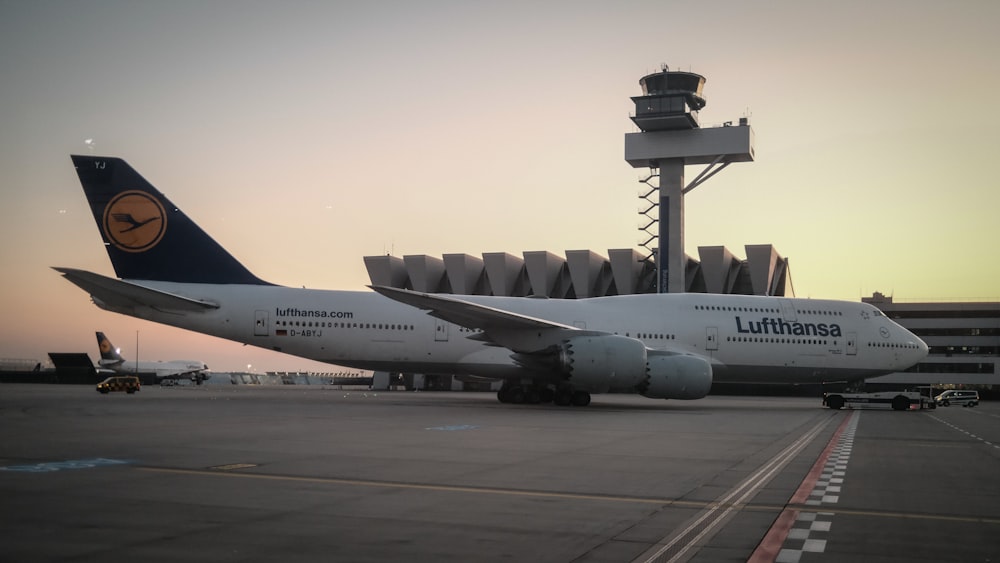 a large jetliner sitting on top of an airport tarmac