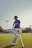 a man standing on top of a field holding a bat