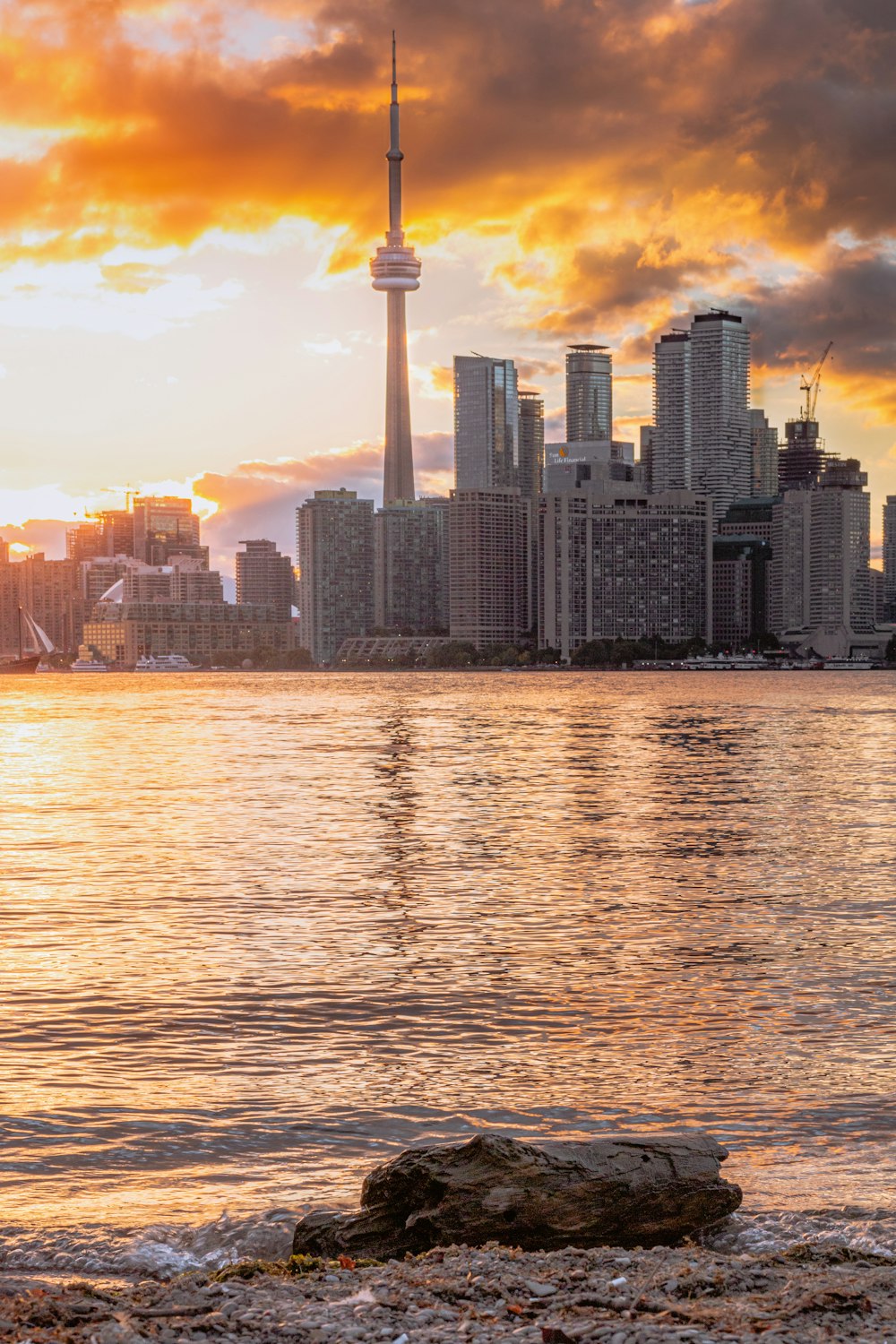 a large body of water with a city in the background