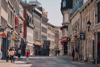 Historic brick buildings of the Harburg city center with bustling shops and cafés on a sunny day.