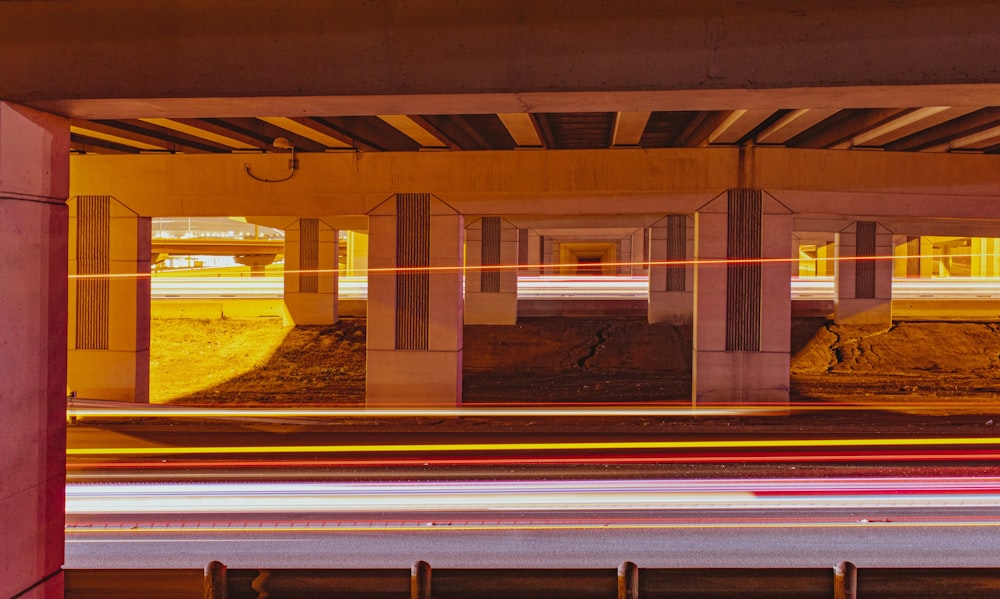 a view of a highway with cars passing under a bridge