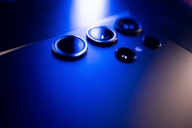 a close up of a cell phone with three buttons