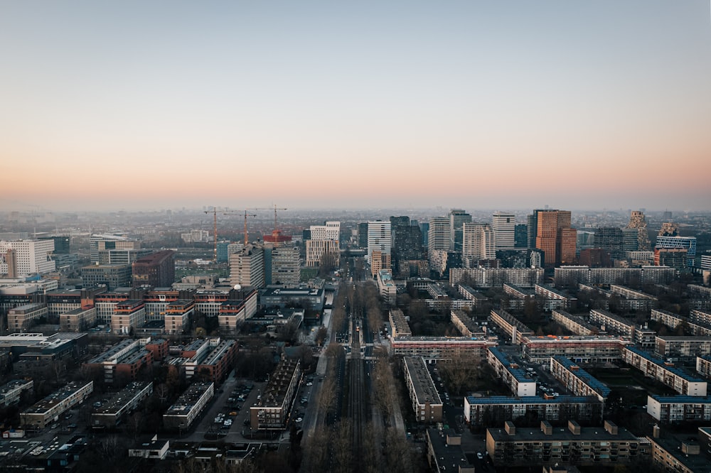 an aerial view of a city with tall buildings