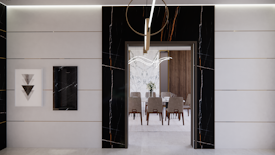 A modern interior features a sleek, minimalist design with a large doorway leading into a dining area. The walls are adorned with black and white marble details, complemented by geometric artwork. The dining room has a wooden table surrounded by upholstered chairs, and a contemporary chandelier hangs overhead.