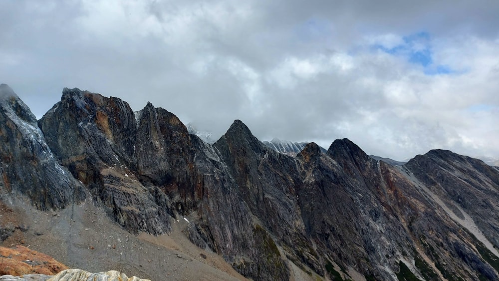 a group of mountains with snow on them