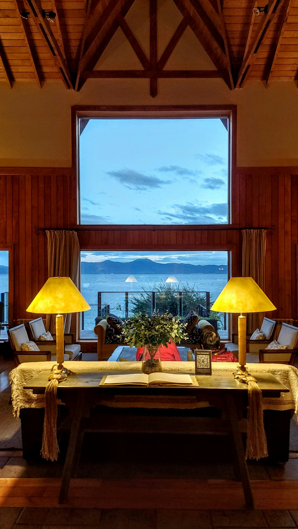 a living room filled with furniture and a large window