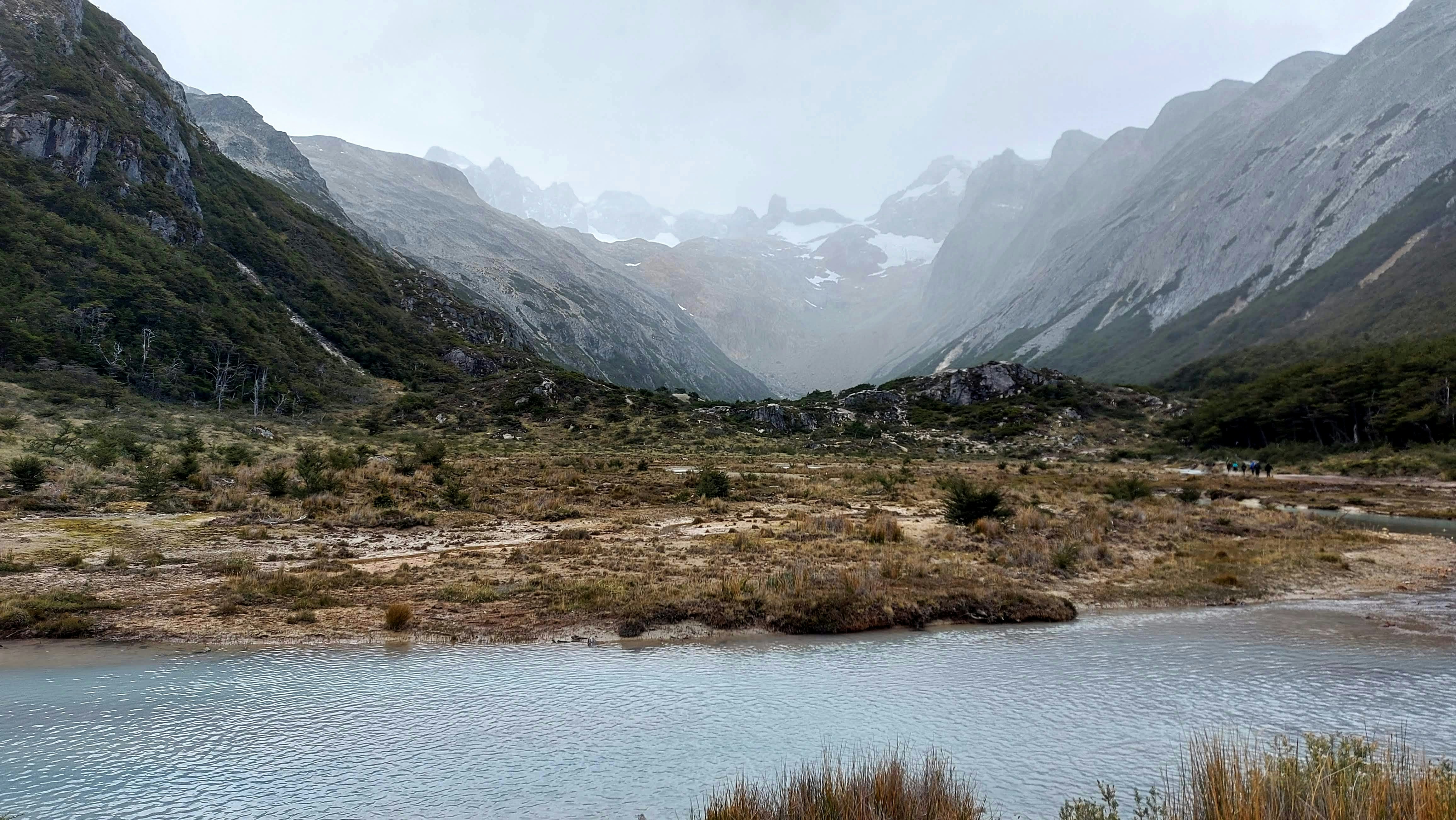 River valley with mountains, representing remote Chile travel and the need for reliable assistance