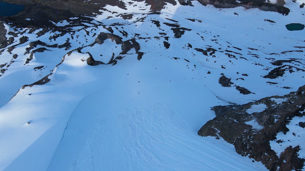 a person skiing down a snowy mountain side