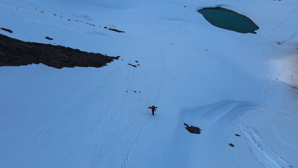 a person skiing down a snow covered mountain