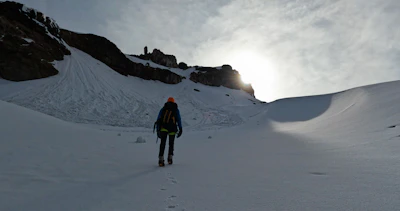 Active hiker ascending Turbacz trail, supported by the sleek hypershell egzoskeleton.