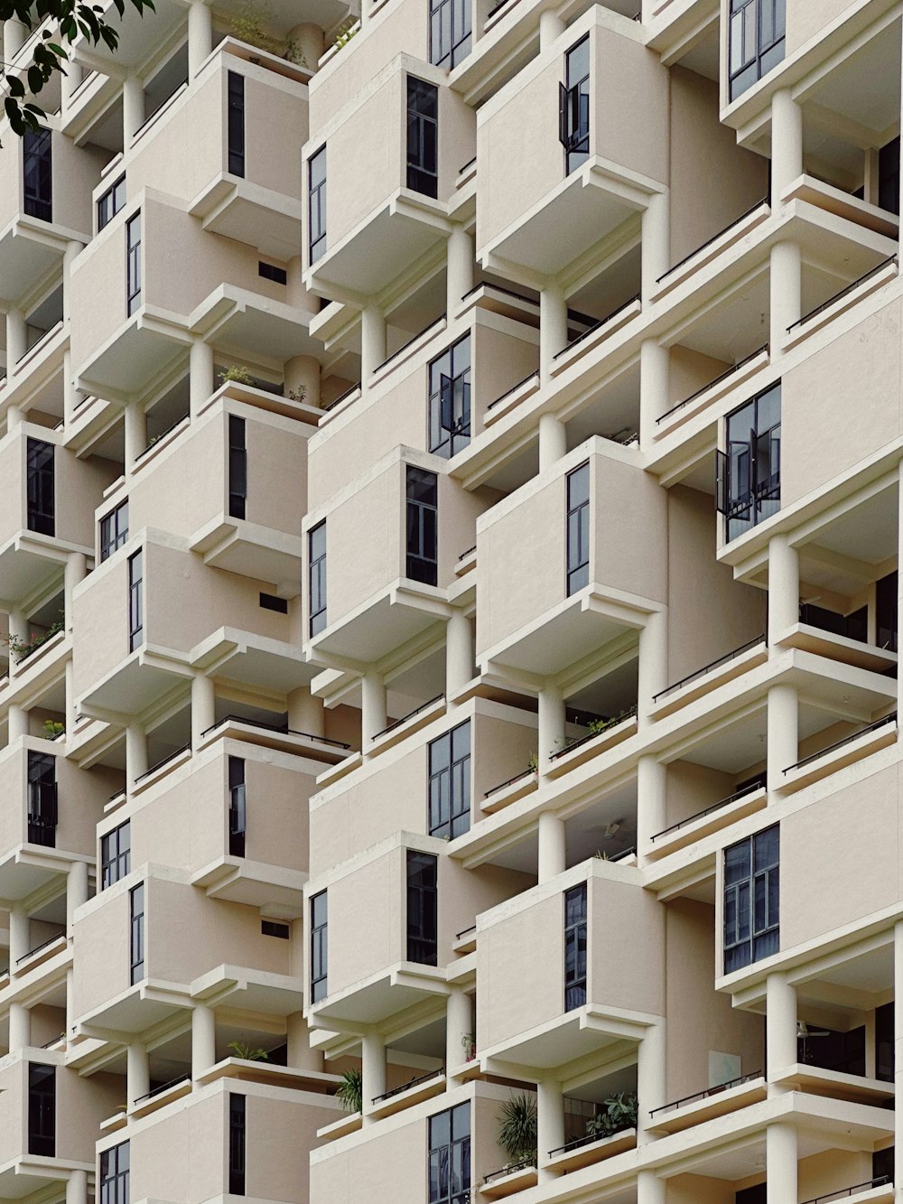 a very tall building with many balconies