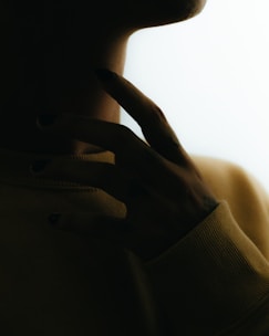 a woman with her hand on her face