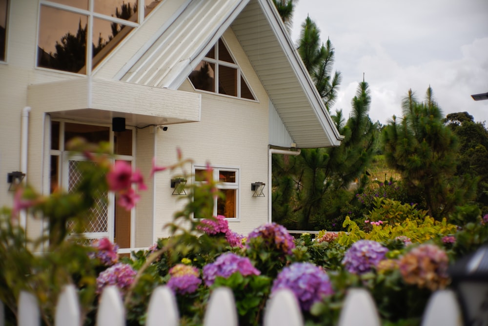 a house with a white picket fence in front of it