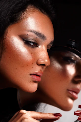 two beautiful women with makeup and manicures on their faces