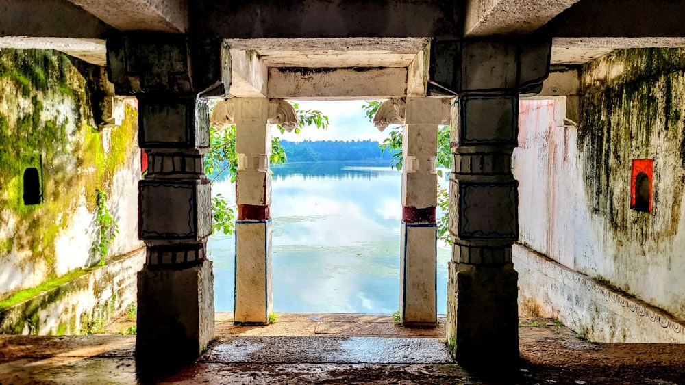 a view of a body of water through an archway
