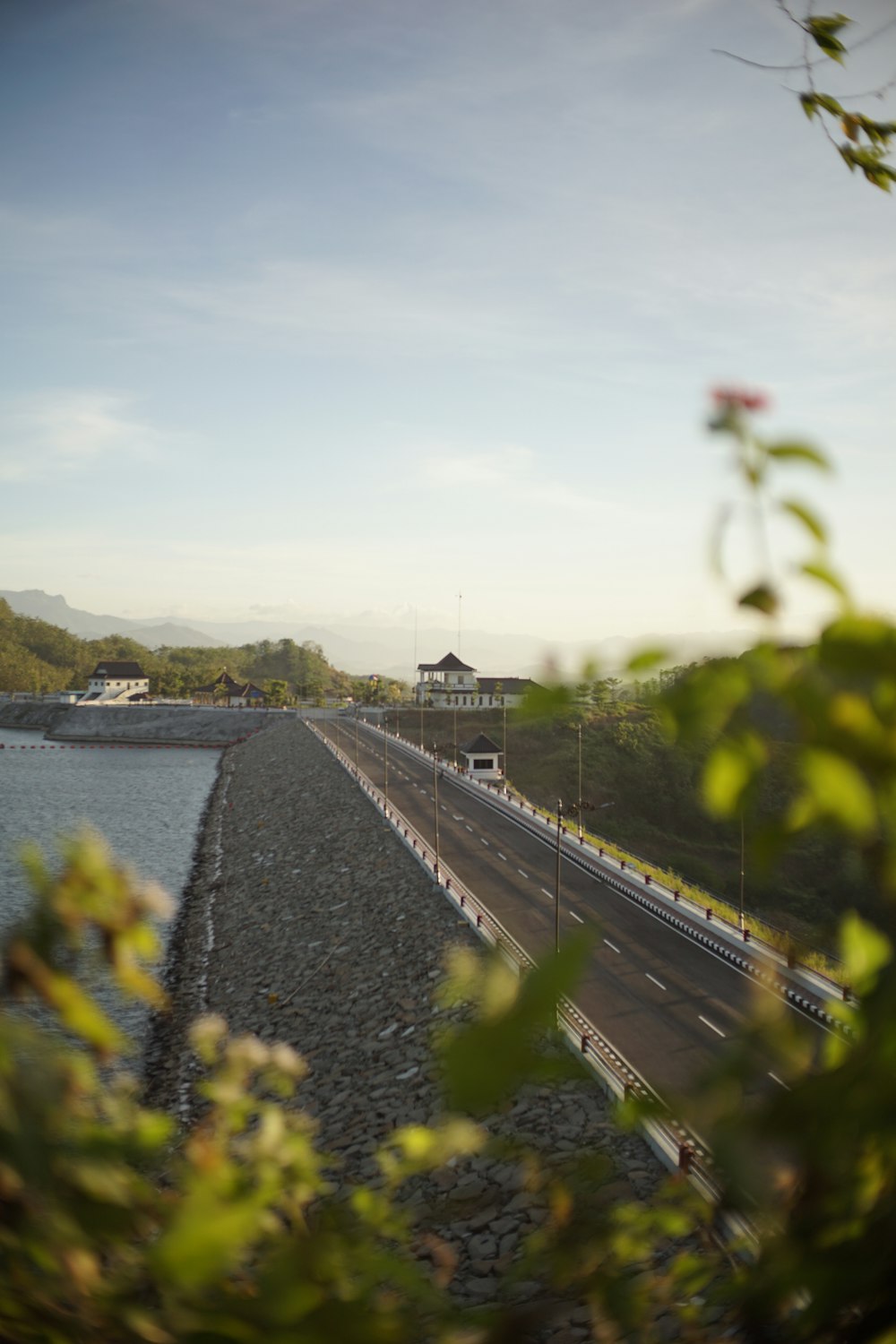 a view of a highway with a bridge in the background