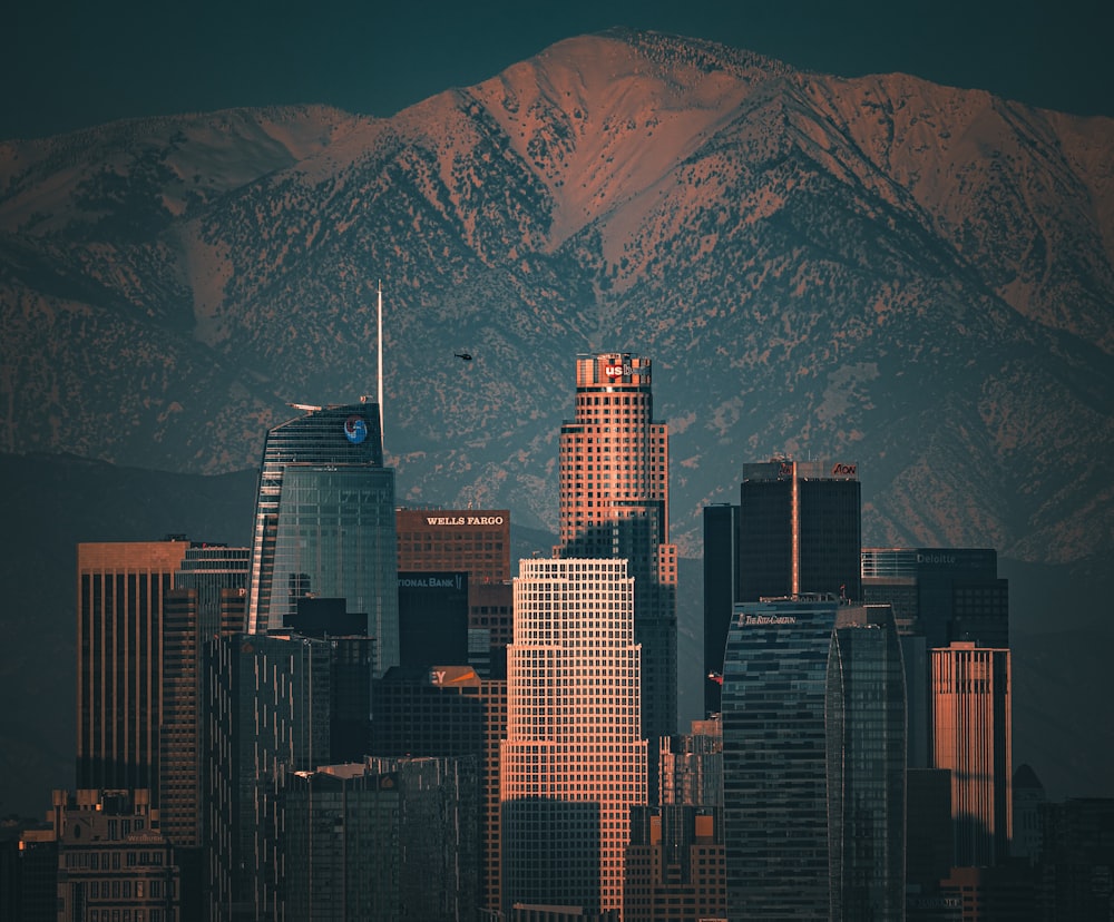 a view of a city with mountains in the background