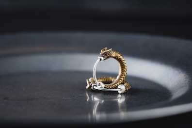 A bold ring shaped like a dragon coiled around a finger.
