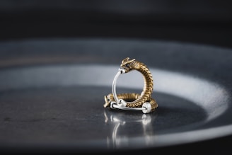 A bold ring shaped like a dragon coiled around a finger.