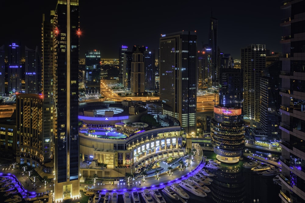 a night view of a city with a lot of tall buildings