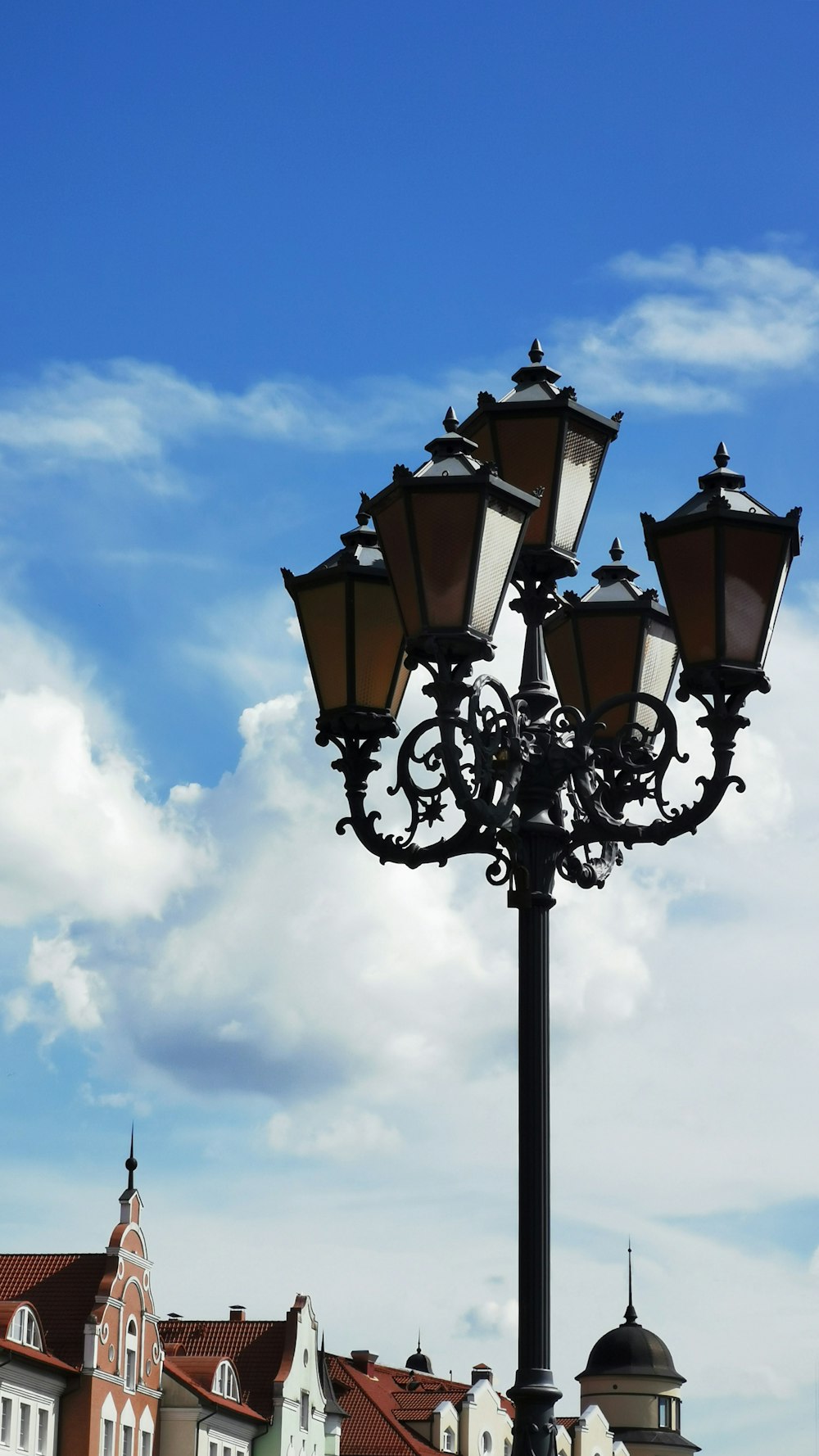 a street light with a sky in the background