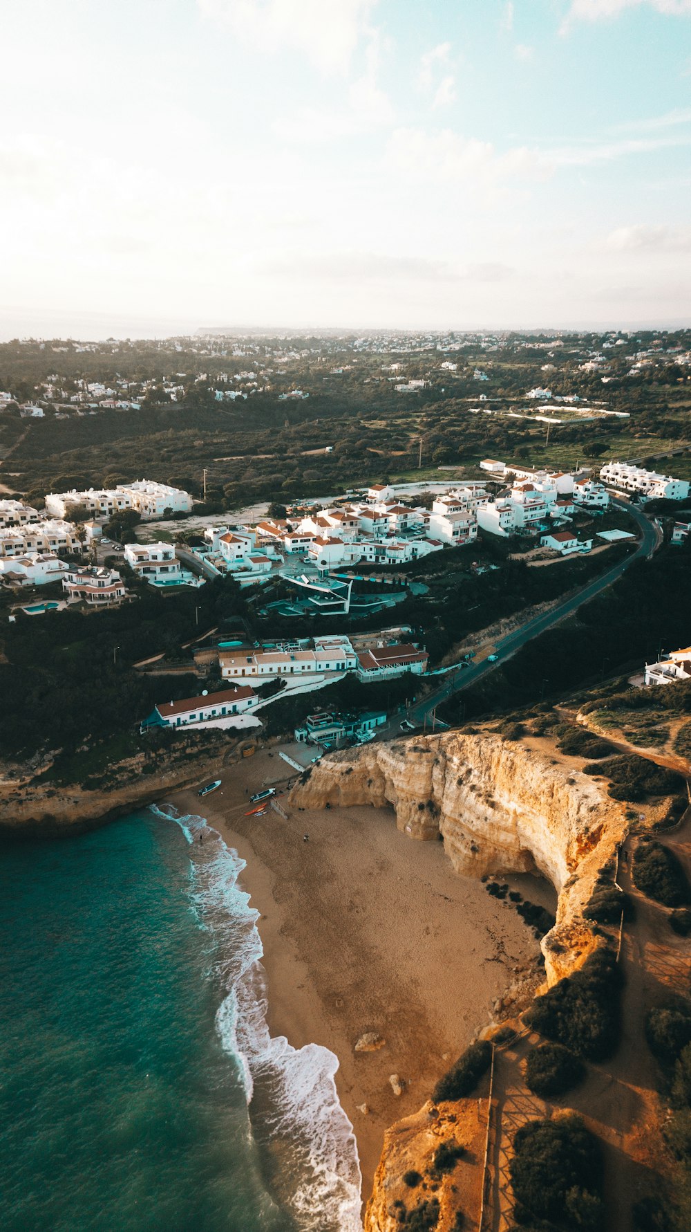 an aerial view of a beach and a city