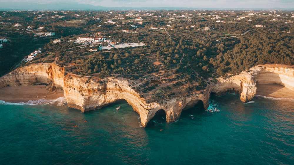 an aerial view of a beach and cliffs