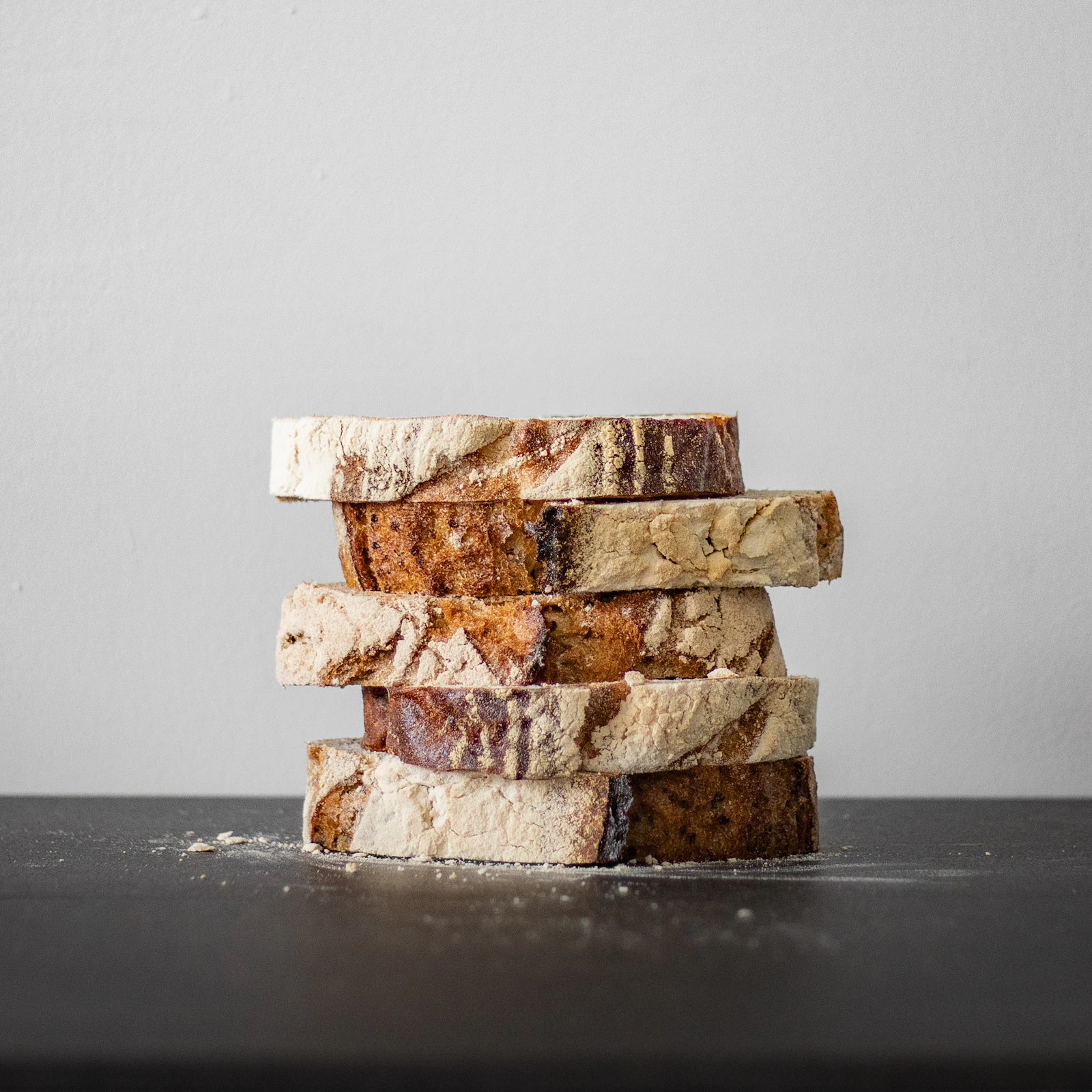 A stack of sourdough loaves on a table