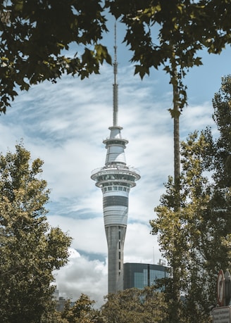 a tall tower with a clock on the top of it