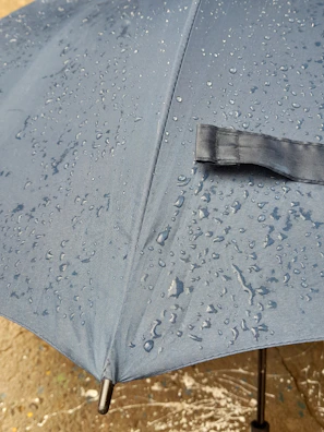 Close-up of a durable, waterproof awning fabric with rain droplets highlighting its quality.